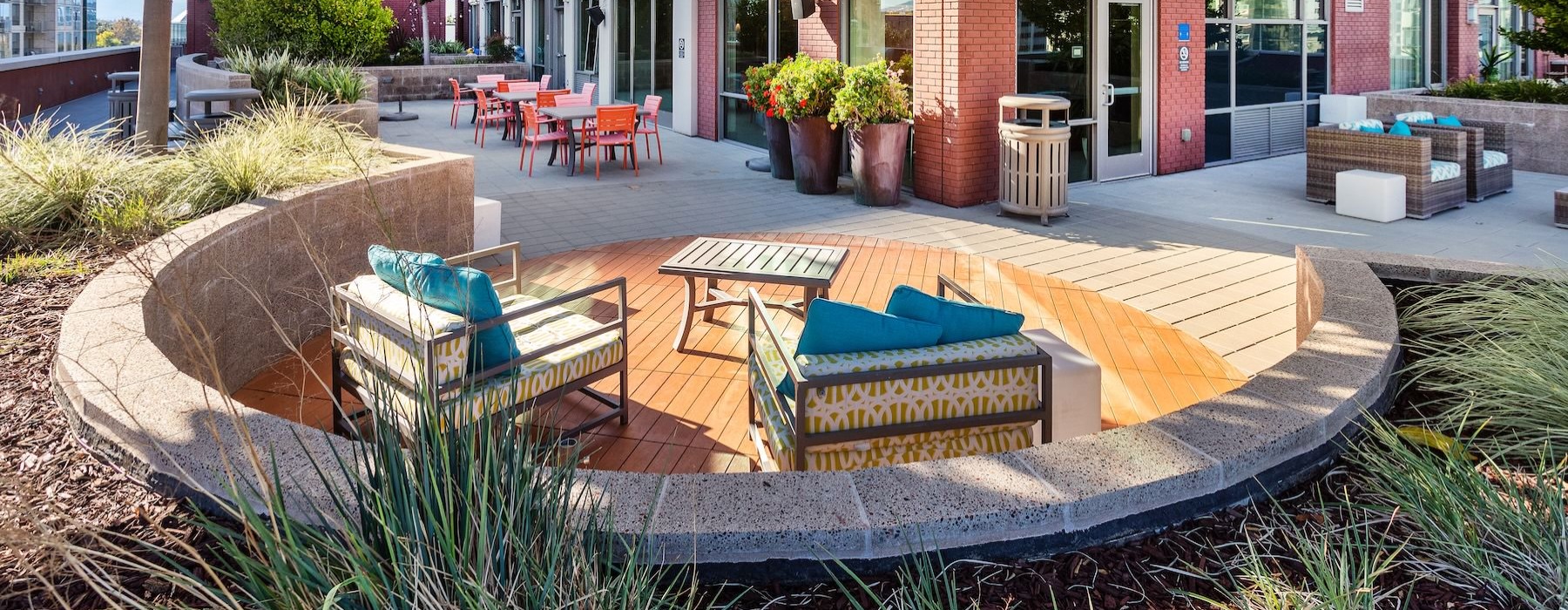 a courtyard with chairs and tables