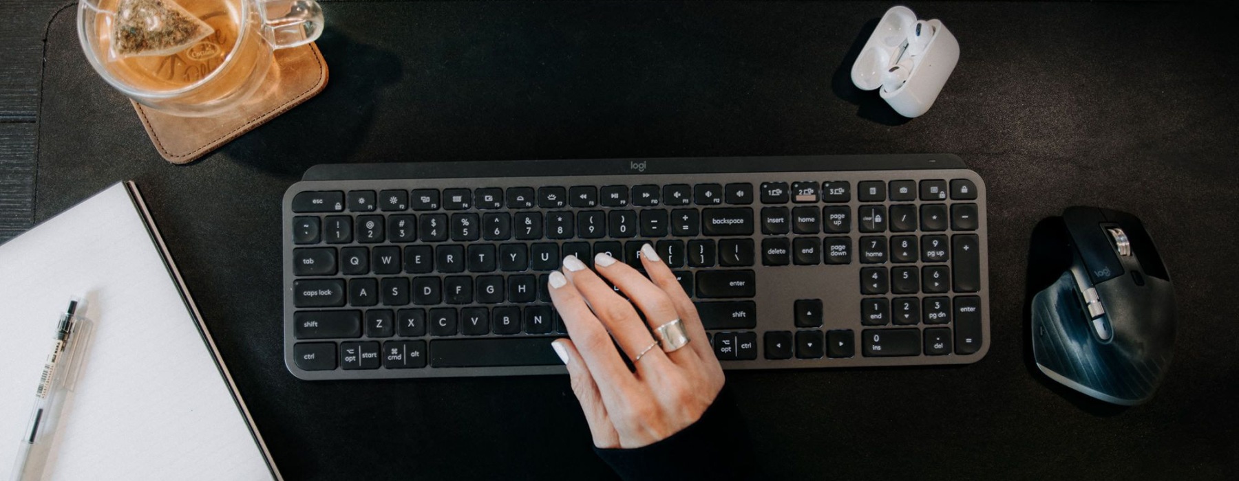 a woman typing on a keyboard