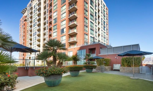 a building with a lawn and trees